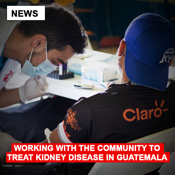 MSF team member examining a patient’s arm.