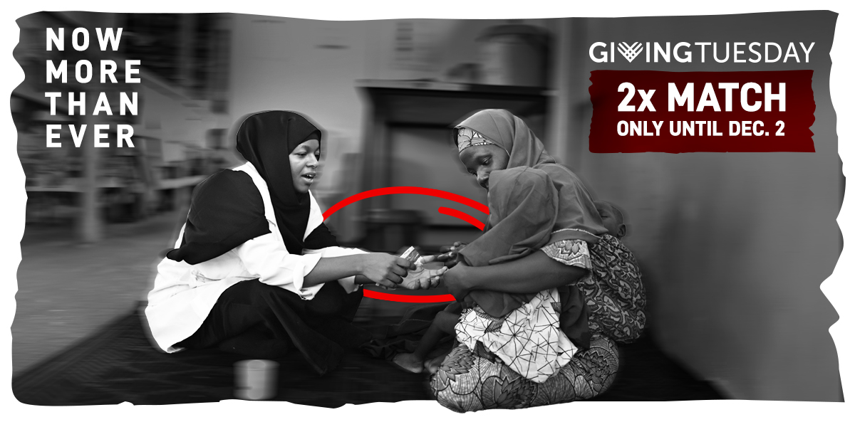 Two surgeons wearing masks and gown perform surgery in an operating theatre in Rutshuru general reference hospital in Democratic Republic of Congo.